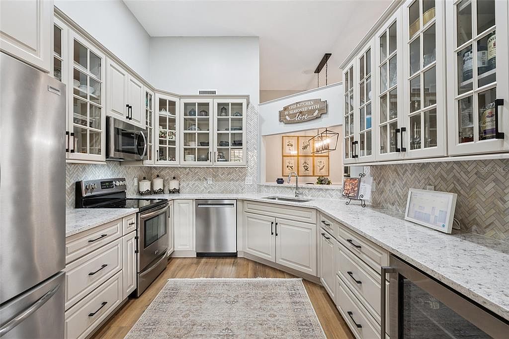 Kitchen with white cabinets and stainless steel appliances