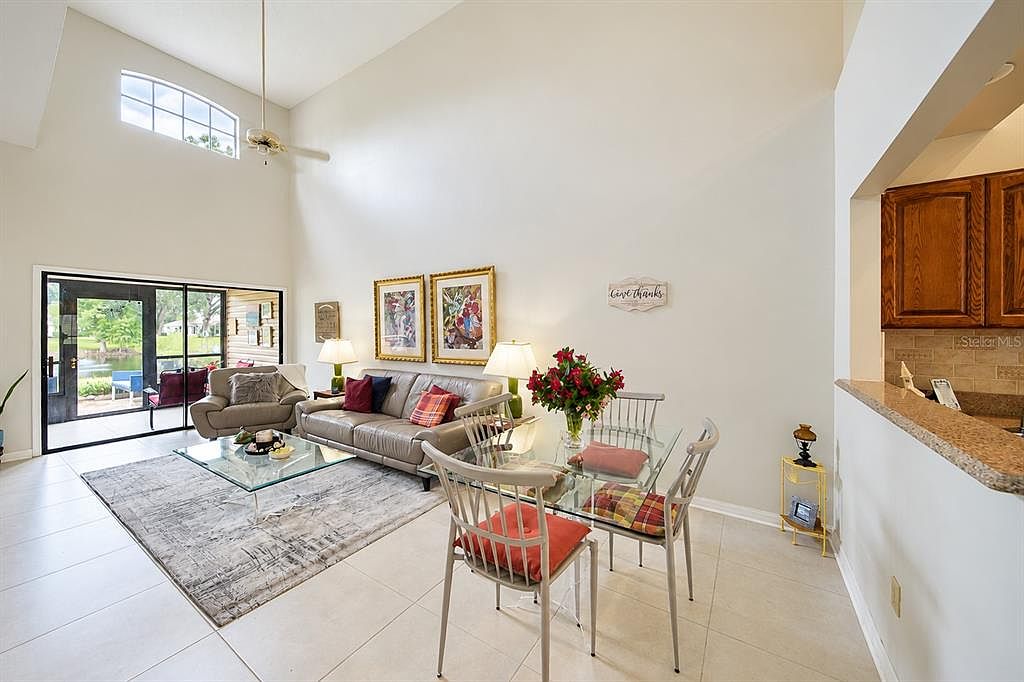 Living and dining area with vaulted ceiling